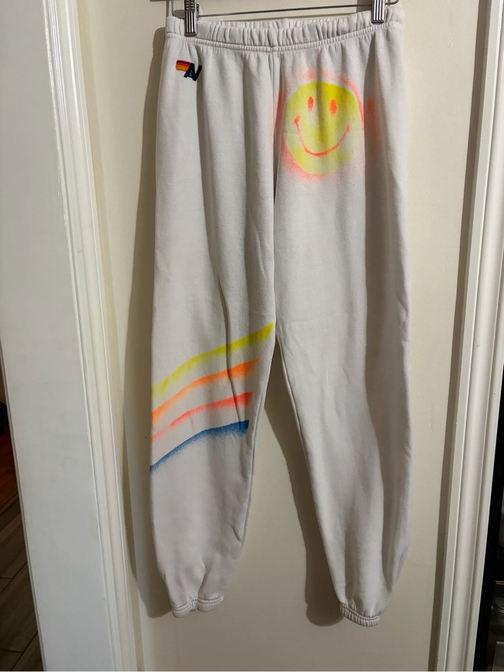 Aviator Nation White Sweatpants with Neon Smile and Rainbow Spray Stripes